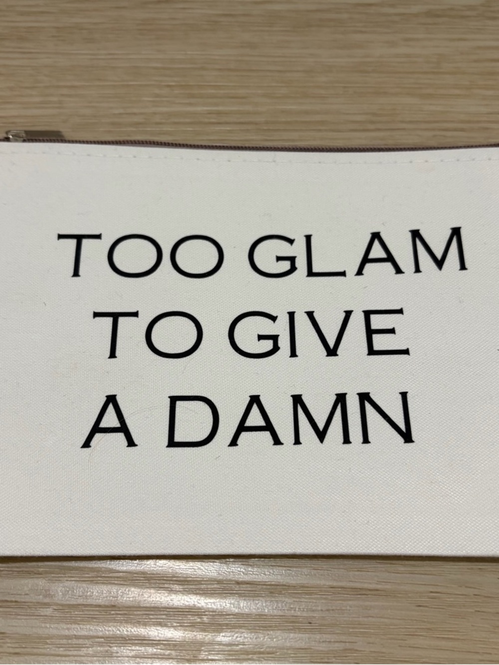 White Canvas Zip Makeup Pouch with Bold Black Slogan. 8x6”